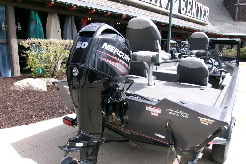 Slide: The Image of 2015 Bass Tracker Pro 17 boat with Mercury 60 engine, parked outside a center. - 4