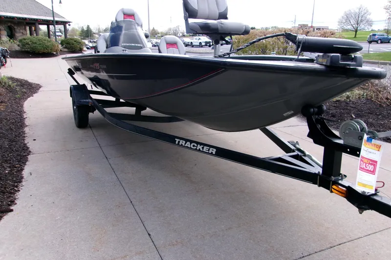 Slide: The Image of 2015 Bass Tracker Pro 17 boat on trailer, displayed outdoors. - 6