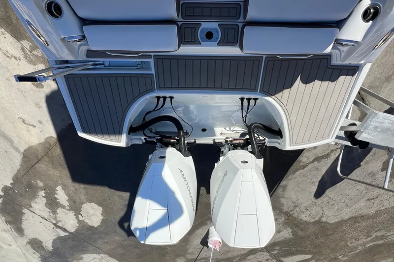 Slide: The Image of Aerial view of 2026 Crownline 310 XSS boat with dual Mercury outboard engines. - 10