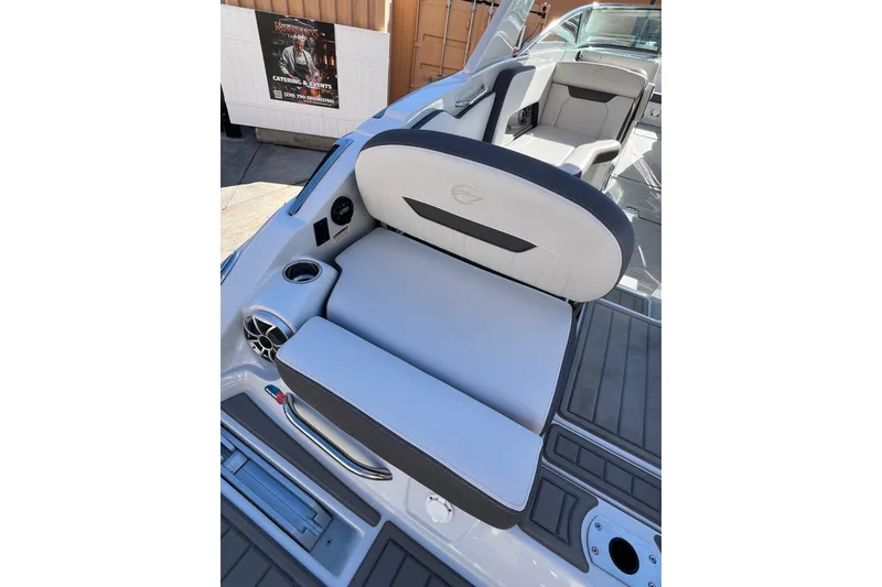 Slide: The Image of 2026 Crownline 310 XSS boat interior with sleek seating and modern design features. - 11