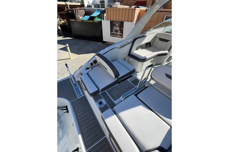 Slide: The Image of 2026 Crownline 310 XSS boat interior with sleek seating and modern design. - 13