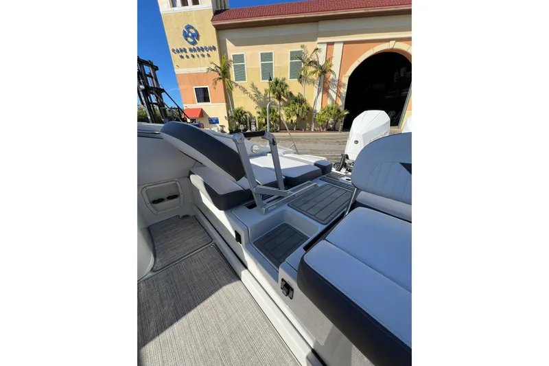 Slide: The Image of Interior view of 2026 Crownline 310 XSS boat with modern seating and sleek design. - 14