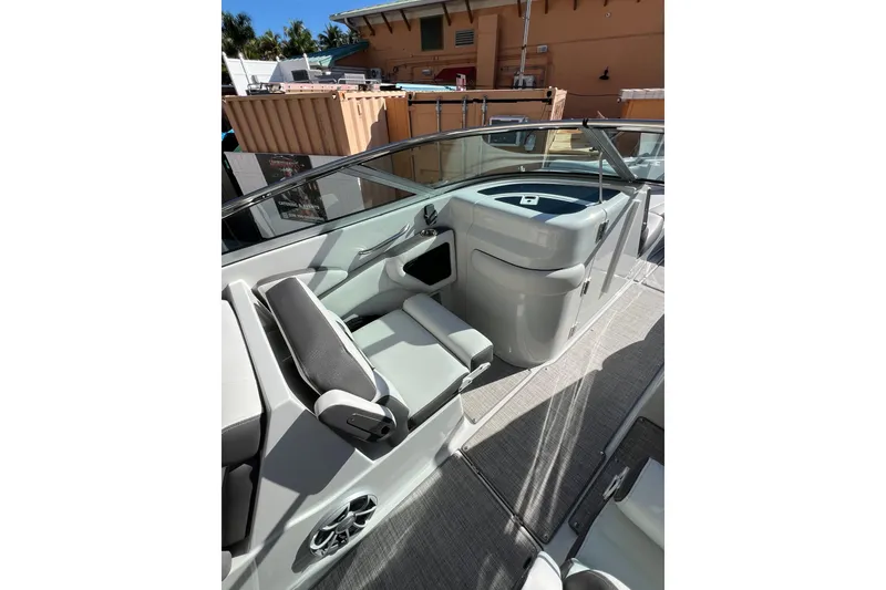 Slide: The Image of Interior view of 2026 Crownline 310 XSS boat, featuring sleek seating and modern design. - 22