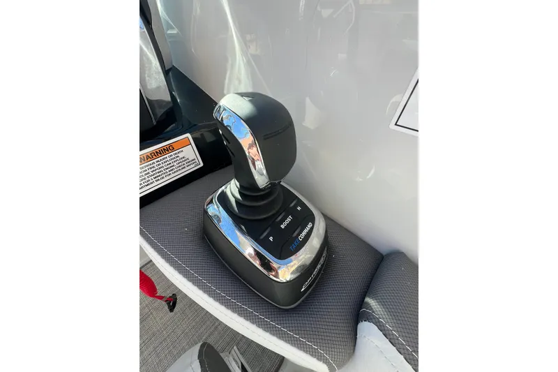 Slide: The Image of Joystick control of 2026 Crownline 310 XSS boat, featuring sleek design and advanced functionality. - 24