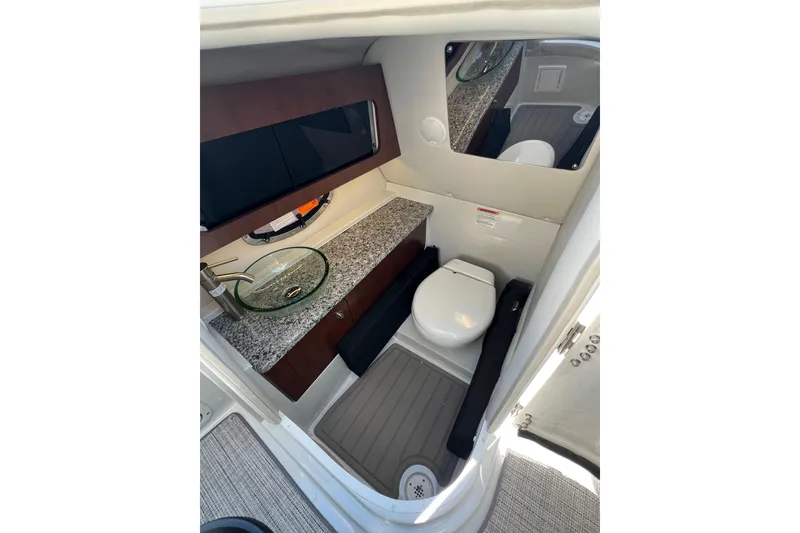 Slide: The Image of Luxurious bathroom interior of 2026 Crownline 310 XSS boat with modern amenities. - 28