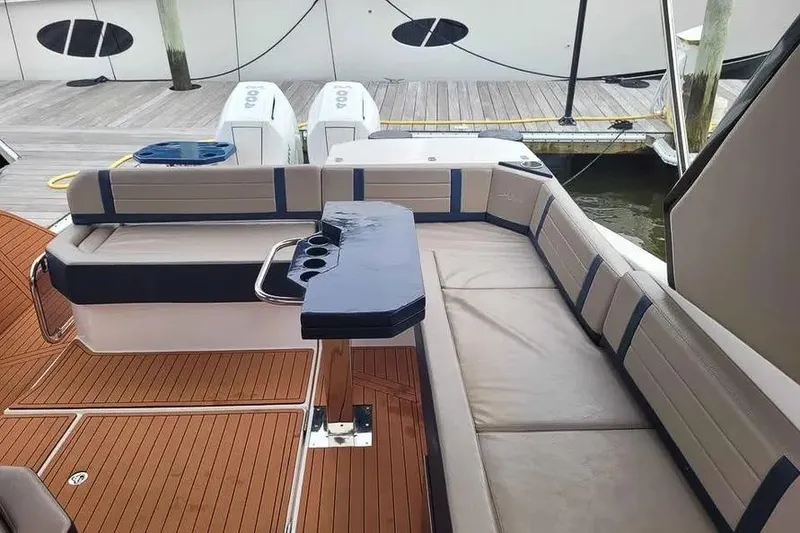 Slide: The Image of Luxurious seating area on 2024 Hanover 387 boat with elegant wood flooring. - 16