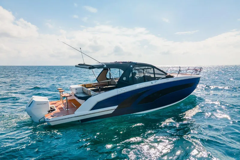 Slide: The Image of 2024 Hanover 387 boat cruising on open sea under clear sky. - 5