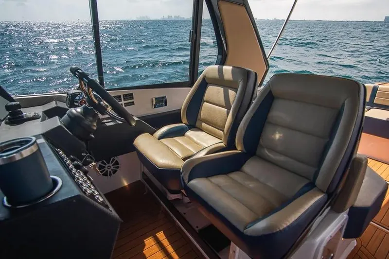 Slide: The Image of Interior of 2024 Hanover 387 boat with luxurious seating and ocean view. - 9