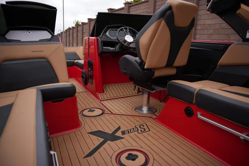 Slide: The Image of Interior of 2022 MasterCraft XStar S boat with luxurious seating and sleek design. - 15