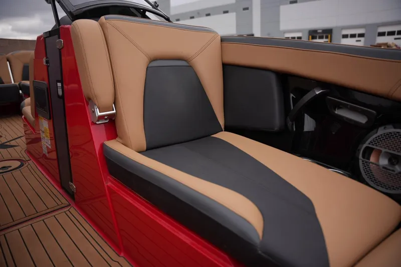 Slide: The Image of Luxurious seating on 2022 MasterCraft XStar S boat, featuring tan and black upholstery. - 9