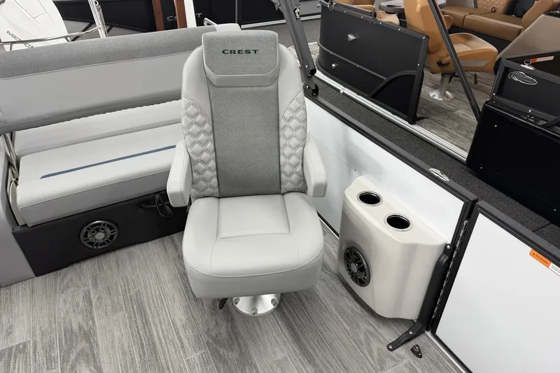 Slide: The Image of Luxury seating on 2026 Crest Conquest 250 SLSC boat with cup holders and speaker. - 10