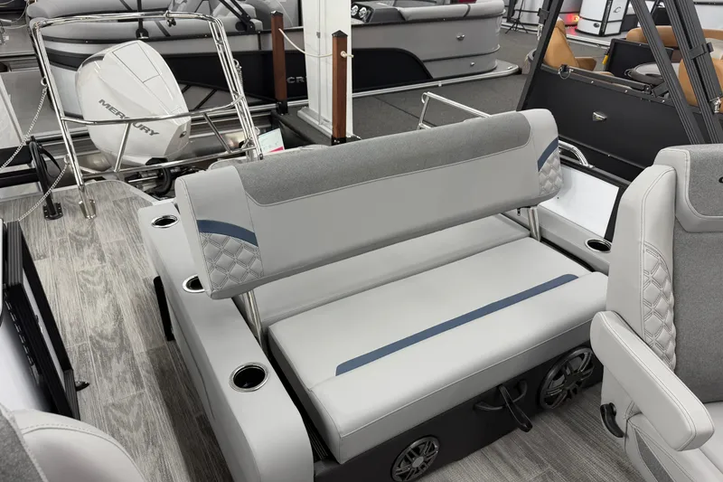 Slide: The Image of 2026 Crest Conquest 250 SLSC boat interior with gray seating and modern design. - 11