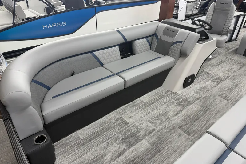 Slide: The Image of 2026 Crest Conquest 250 SLSC boat interior with sleek gray seating and modern design. - 4