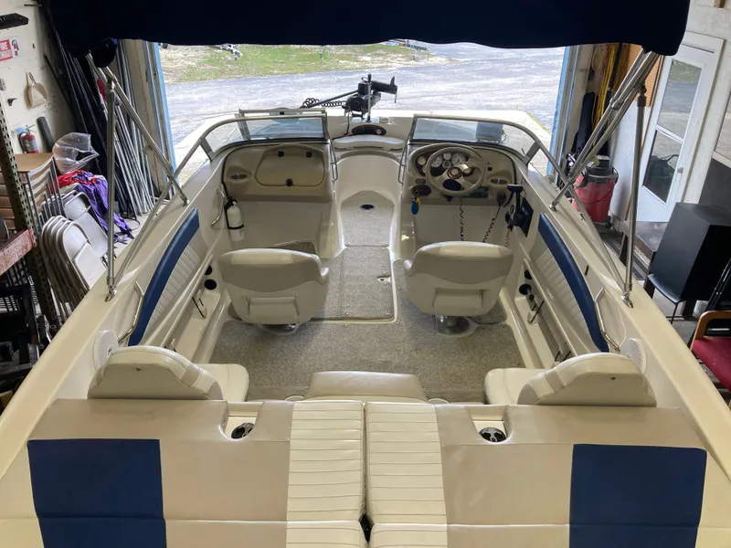 Slide: The Image of Interior view of a 2007 Glastron GT 205 boat in a garage. - 10
