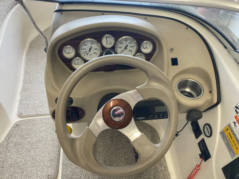 Slide: The Image of Dashboard of a 2007 Glastron GT 205 boat with speedometer. - 13