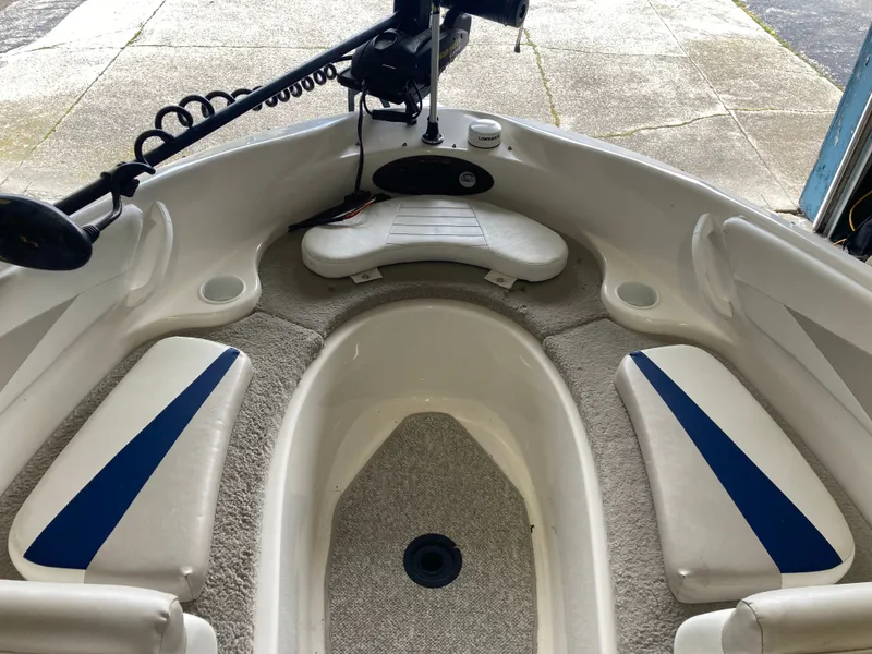 Slide: The Image of Interior of a 2007 Glastron GT 205 boat with blue accents. - 16