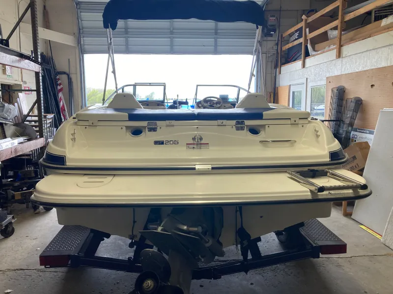 Slide: The Image of Rear view of a 2007 Glastron GT 205 boat in a garage. - 2