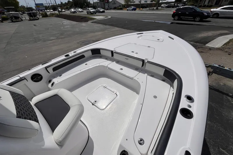 Slide: The Image of 2026 Tidewater 2300 Carolina Bay boat interior with seating and storage compartments. - 10