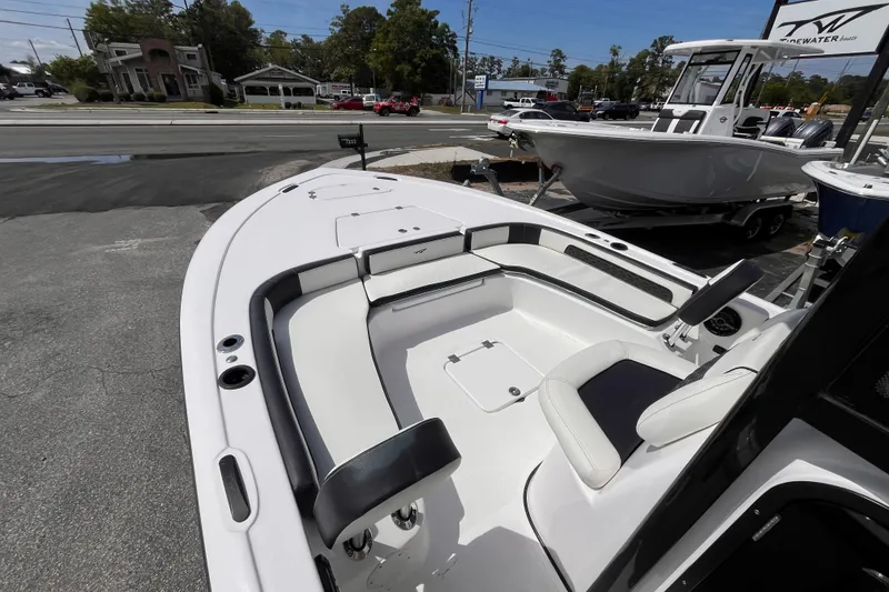 Slide: The Image of 2026 Tidewater 2300 Carolina Bay boat, interior view, parked outdoors. - 11