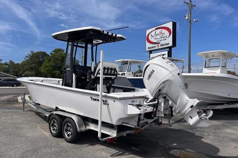 Slide: The Image of 2026 Tidewater 2300 Carolina Bay boat with Yamaha engine at Marker 17 Marine dealership. - 2