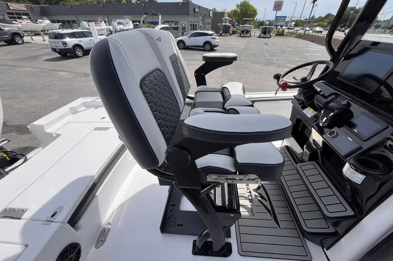 Slide: The Image of 2026 Tidewater 2300 Carolina Bay boat interior with modern seating and control panel. - 6