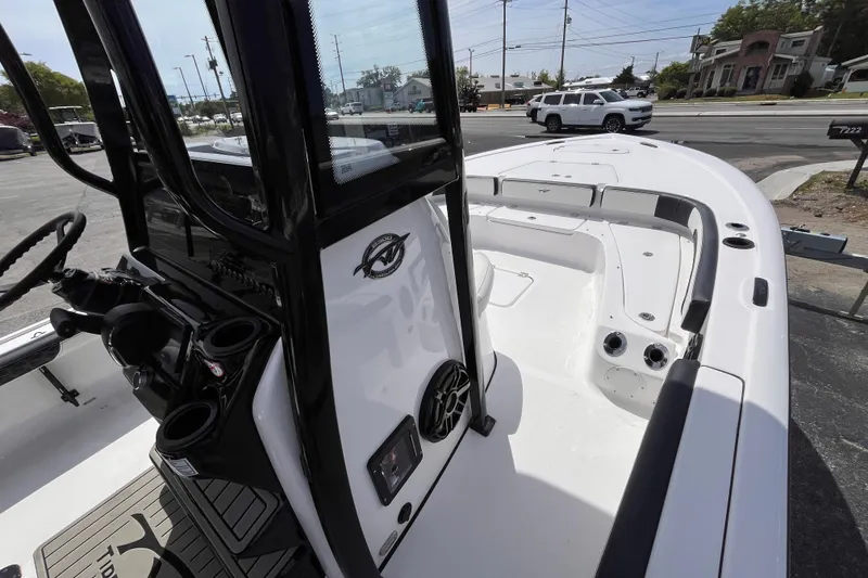 Slide: The Image of 2026 Tidewater 2300 Carolina Bay boat interior view in a parking lot. - 9