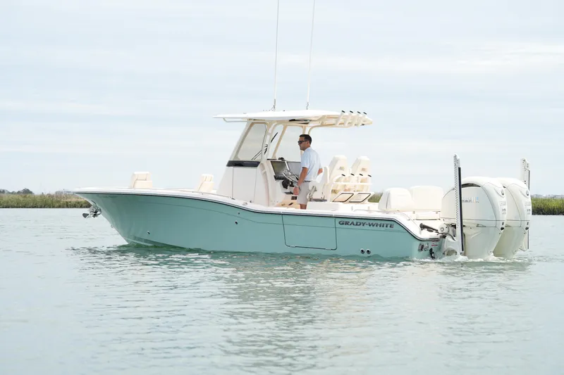 The Image of 2024 Grady-White 281 Coastal Explorer boat cruising on calm waters. - 1