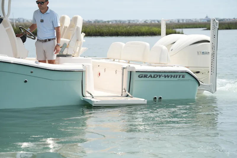 Slide: The Image of 2024 Grady-White 281 Coastal Explorer boat on water, featuring sleek design and modern amenities. - 14