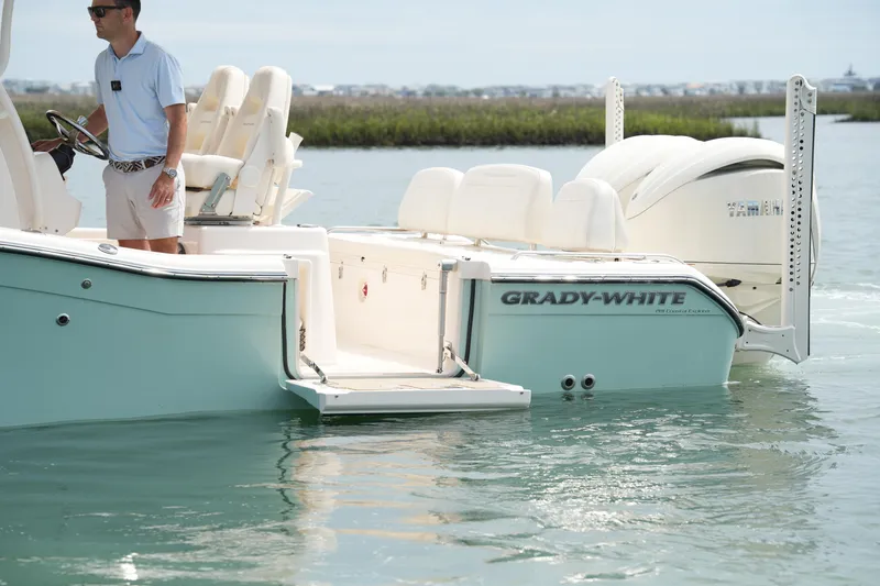 Slide: The Image of 2024 Grady-White 281 Coastal Explorer boat on water, featuring sleek design and modern amenities. - 15