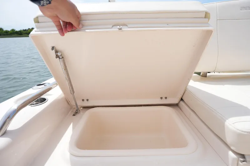Slide: The Image of Open storage compartment on 2024 Grady-White 281 Coastal Explorer boat, near water. - 18