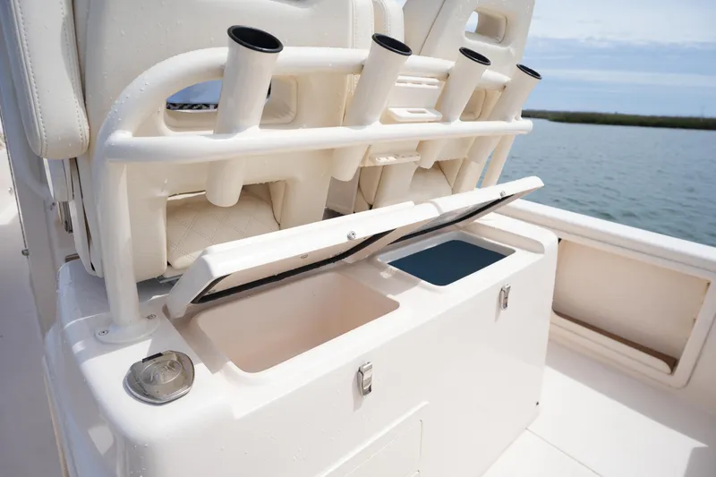 Slide: The Image of 2024 Grady-White 281 Coastal Explorer boat with open storage compartments and rod holders. - 19