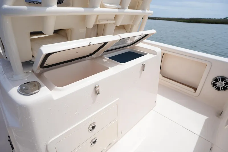 Slide: The Image of 2024 Grady-White 281 Coastal Explorer boat interior with open storage compartments. - 20