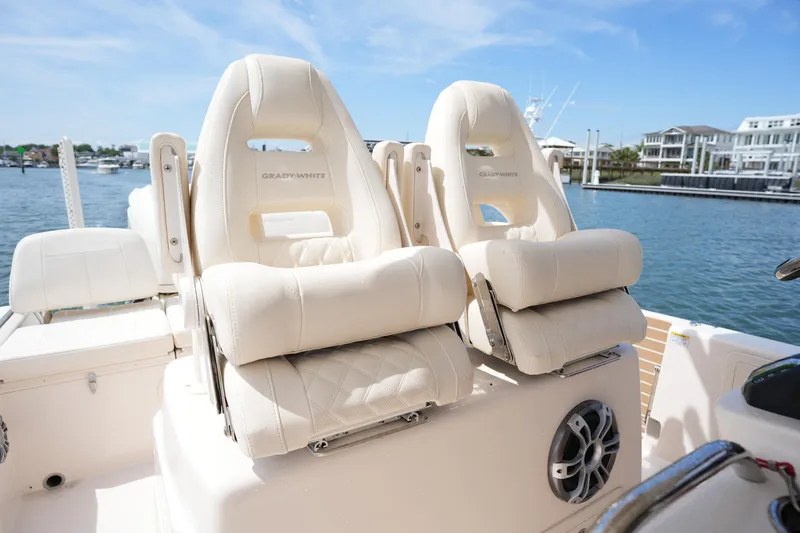 Slide: The Image of 2024 Grady-White 281 Coastal Explorer boat seats with waterfront view. - 23