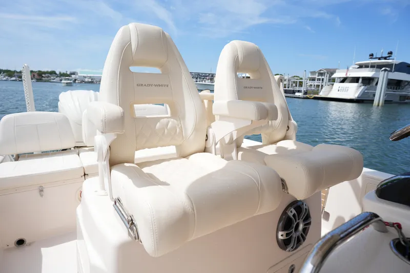 Slide: The Image of 2024 Grady-White 281 Coastal Explorer boat seats, luxurious design, docked by the marina. - 24