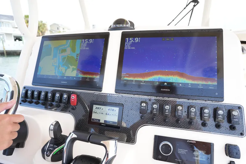 Slide: The Image of 2024 Grady-White 281 Coastal Explorer dashboard with Garmin navigation displays. - 26