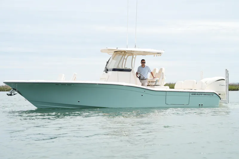 Slide: The Image of 2024 Grady-White 281 Coastal Explorer boat on calm water, side view. - 3