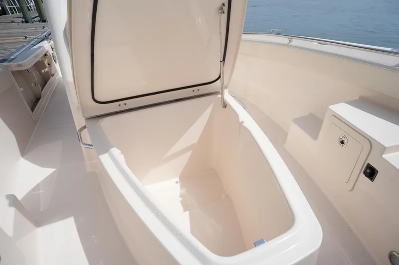 Slide: The Image of Open storage compartment on 2024 Grady-White 281 Coastal Explorer boat. - 35