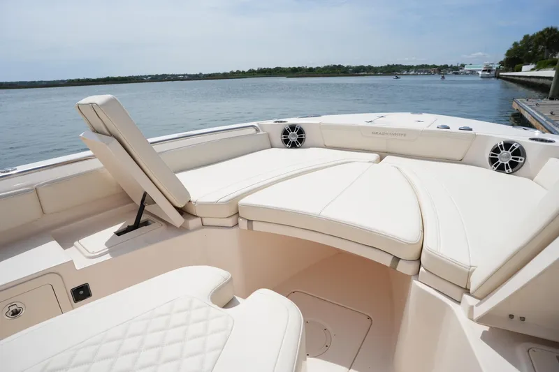 Slide: The Image of 2024 Grady-White 281 Coastal Explorer boat interior with luxurious seating and scenic water view. - 36