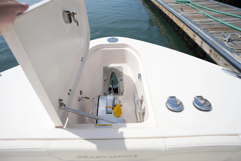 Slide: The Image of 2024 Grady-White 281 Coastal Explorer anchor compartment, open at dockside. - 38