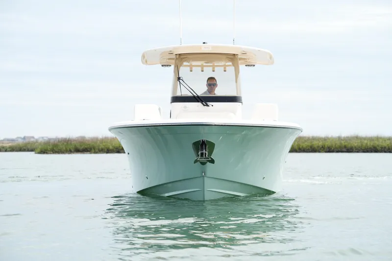 Slide: The Image of 2024 Grady-White 281 Coastal Explorer boat on calm water, front view. - 6