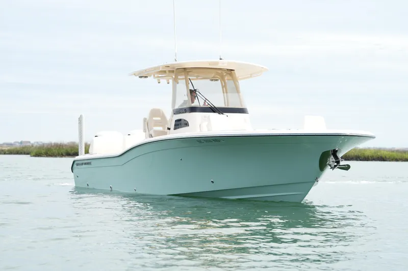 Slide: The Image of 2024 Grady-White 281 Coastal Explorer boat on calm water, showcasing sleek design. - 7