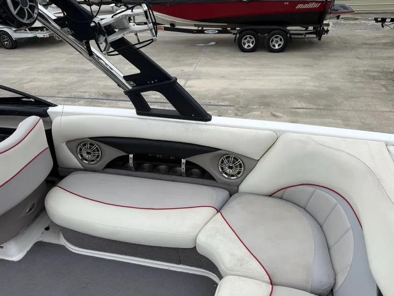 Slide: The Image of Interior of a 2010 Malibu Wakesetter 23 LSV with white seating. - 13