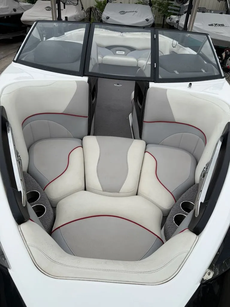 Slide: The Image of Interior of a 2010 Malibu Wakesetter 23 LSV with gray and white seating. - 2