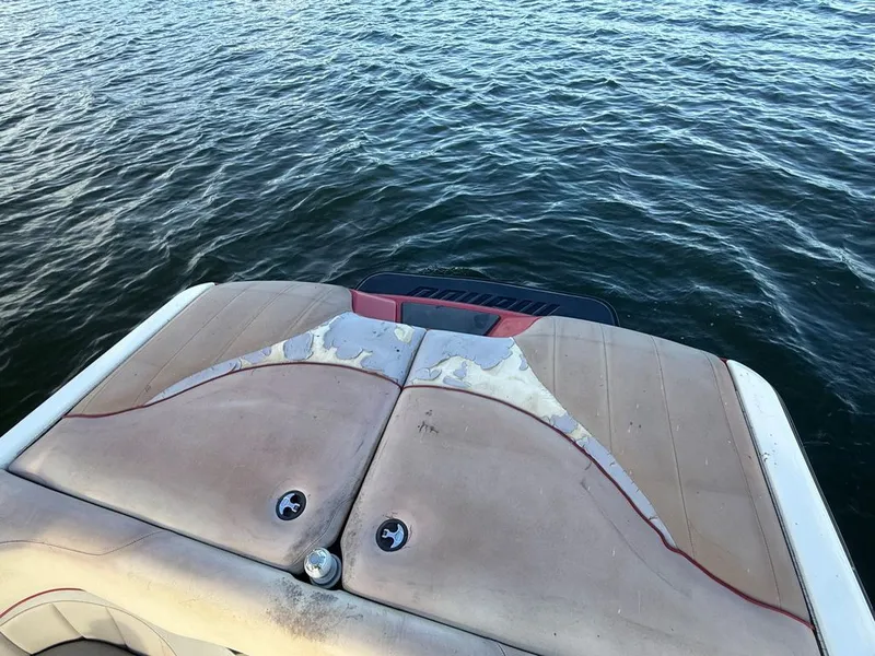 Slide: The Image of Rear view of a 2010 Malibu Wakesetter 23 LSV on the water. - 24
