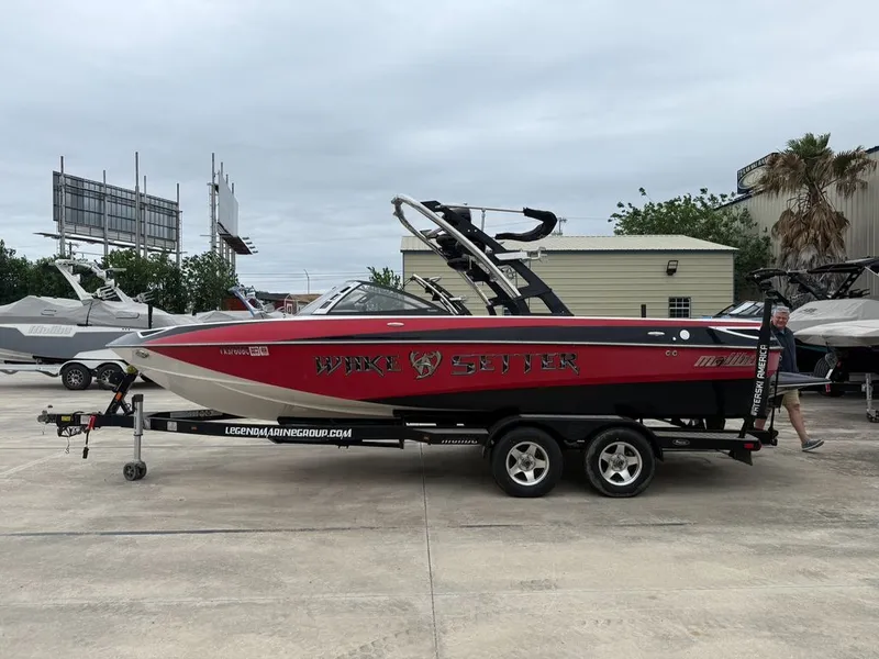 Slide: The Image of 2010 Malibu Wakesetter 23 LSV boat on trailer outdoors. - 30