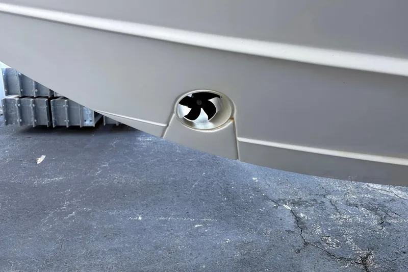 Slide: The Image of 2020 Pursuit DC 365 Dual Console boat hull with visible thruster detail. - 18