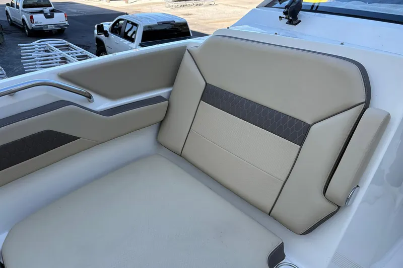 Slide: The Image of 2020 Pursuit DC 365 Dual Console boat seat with beige and gray upholstery. - 6