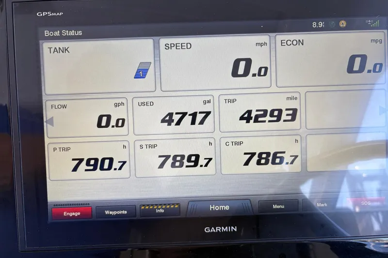 Slide: The Image of Garmin GPS display on 2020 Pursuit DC 365 Dual Console showing boat status and trip data. - 9