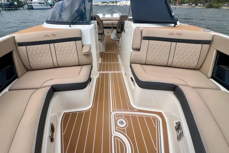 Slide: The Image of Luxurious interior of 2017 Sea Ray SLX 350 Outboard with elegant seating and teak flooring. - 13