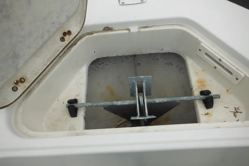 Slide: The Image of Anchor compartment of 2005 Sailfish 218 CC boat, showing anchor storage area. - 12